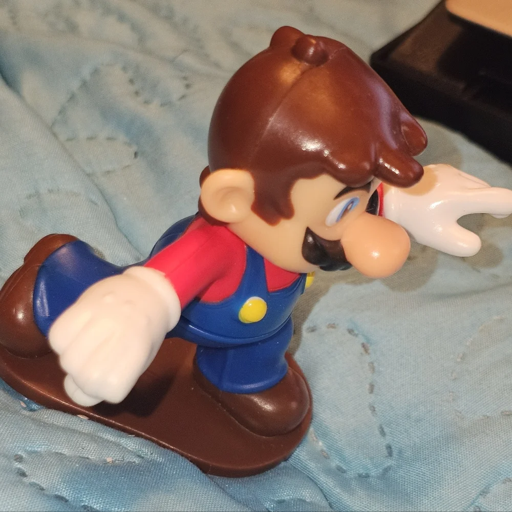 McDonald's Happy Meal toy featuring Mario from the Super Mario Bros. franchise.‎